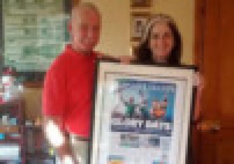 Dympna Tuohy opens her Christmas present from her husband Andy