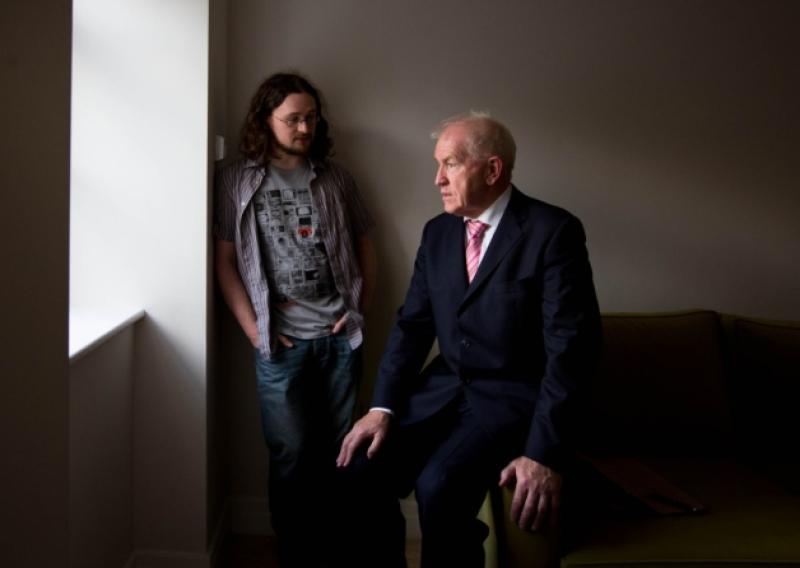 Minister Deenihan talking to artist Paul Quast, who has received a subsidised apartment in John's Square in Limerick city