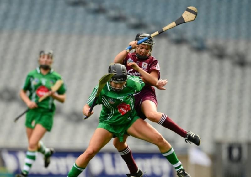 Fiona Hickey, Limerick, in action against Aoife Donoghue, Galway, in the All Ireland intermediate camogie final in Croke Park on Sunday