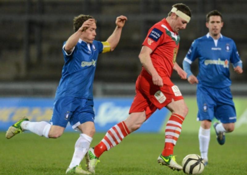 Limerick FCs Joe Gamble closes down Cork City striker and former Blues frontman Denis Behan in the sides Airtricity League Premier Division tie at Thomond Park