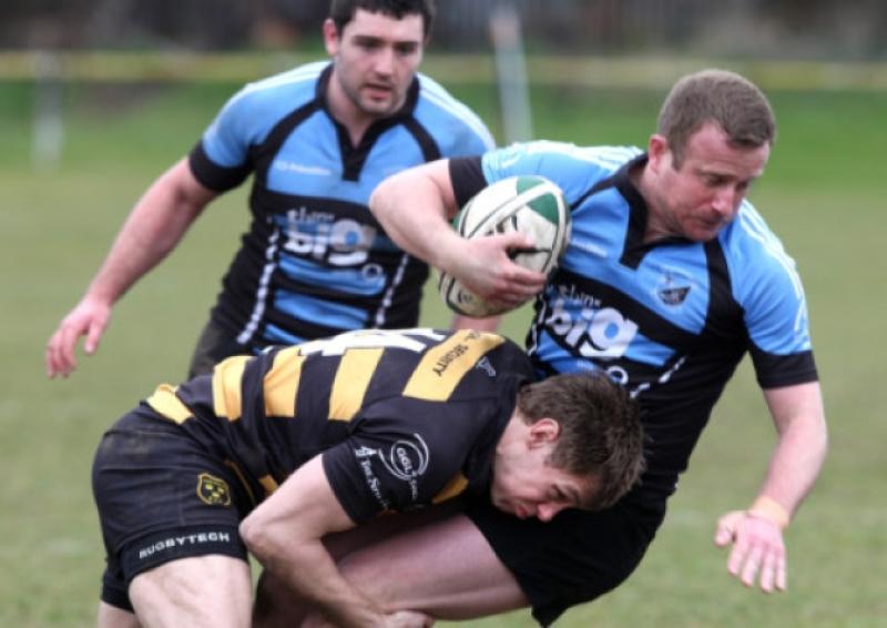Shannon's David O'Donovan is tackled by Young Munster's Craig O'Hanlon during their AIL Division 1A tie at Tom Clifford Park on Saturday