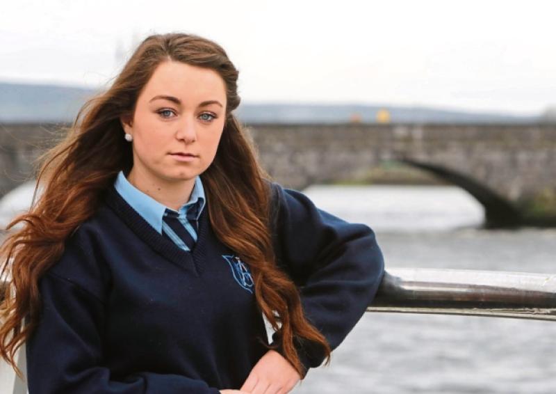 Katie Whelan, pictured at Thomond Bridge where signs esposing positive, life affirming messages have been erected