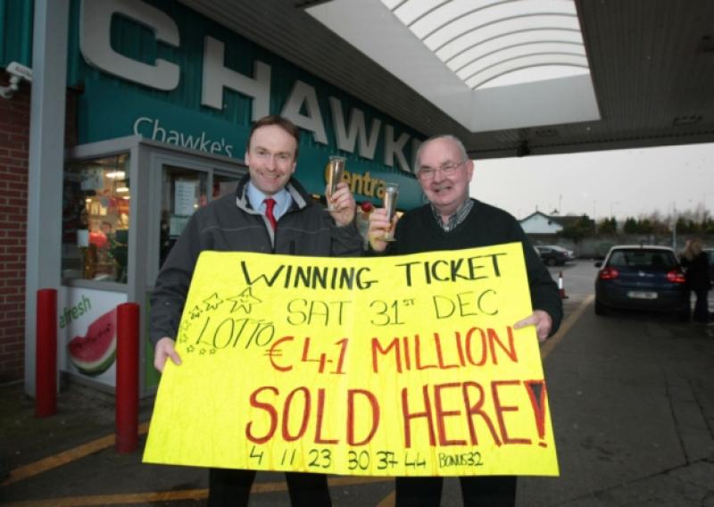 Tom Duggan, manager, and Tom Chawke, owner, after selling the winning �4.1m Lotto ticket in Chawkes shop in Castletroy and below, installing the first National Lottery terminal outside Dublin at Maye's of Parnell Street were Hubert Maye (centre), Pat O'Shea and Tony Lavin