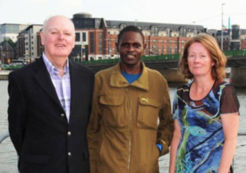 Austin Reid, president of St Michael's rowing club, with Ugandan athlete Moses Kipsiro, and Antoinette Ahern, Urban Run co-ordinator