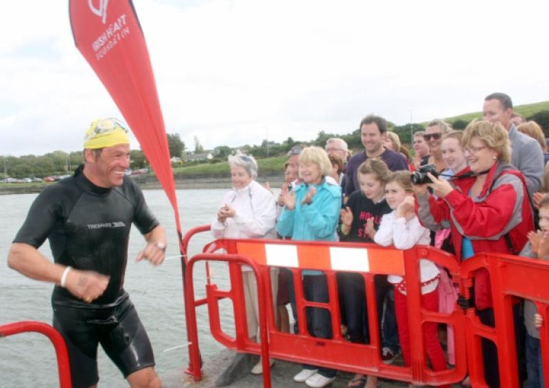 Spectators show their appreciation for actor Dominic West after he swam from the Clare shore to the Limerick shore, during the Glin swim, in aid of the Irish Heart Foundation         [Picture: Dave Gaynor]