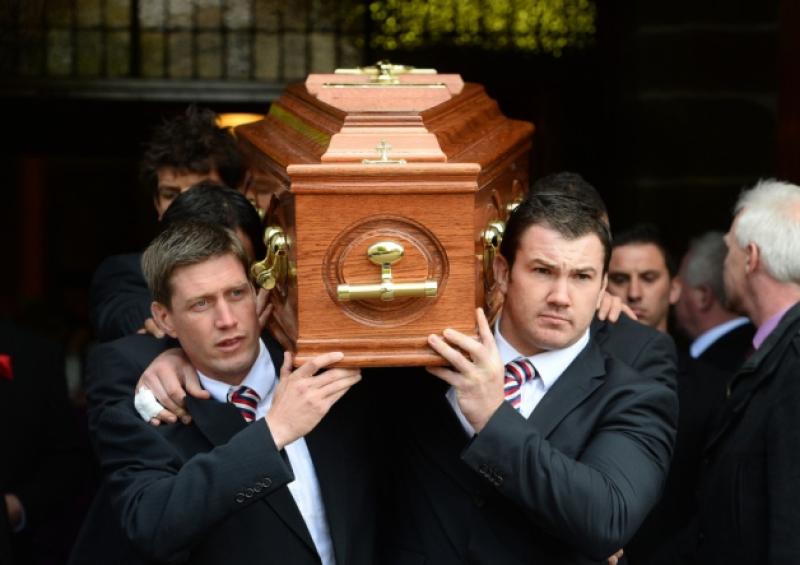 Ronan O'Gara and Damien Varley carrying the coffin of Donal Walsh at his funeral in Tralee last May and below, the late Donal Walsh, 16, who captured the hearts of the nation