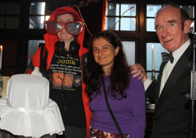 Regular readers at the White House pub Clare Dollard and Marian Cody dressed up as a popstar and a ghost with poetry compere  Barney Sheehan. Also pictured is Jennifer Wu, who travelled from Florida for the event [Picture: Brendan Gleeson]