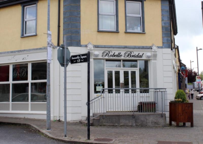 Robelle Bridal shop in Annacotty was closed to customers, with just a few dresses left hanging inside the store. Below, Shirley Flanagan