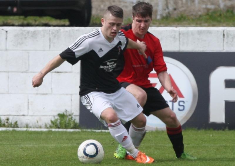 Janesboro's Shane Waters turns his Tralee Dynamos marker in their Munster Junior Cup semi-final tie at Jackman Park. The Kerry side emerged 3-1 winners in the game