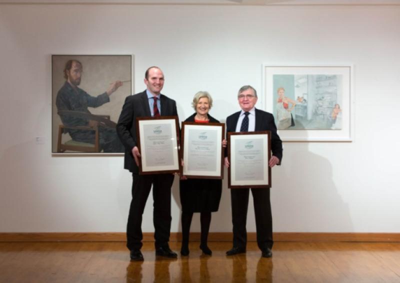 Pictured with scrolls from Limerick City and County Council were: Richard Langford, relative of Charlotte Grace O'Brien, Iseult Murphy, relative of Sophie Mary Peirce and John O'Brien, Kate O'Brien's nephew. Picture: Sean Curtin