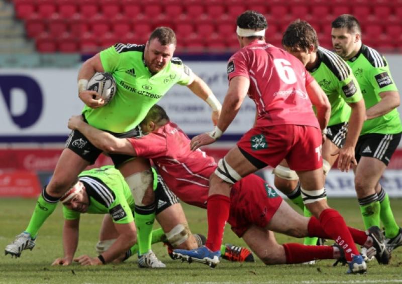Munster prop Dave Kilcoyne is tackled by Ken Owens of the Scarlets in the sides' Guinness PRO12 clash at Parc y Scarlets on Saturday which ended in a 25-25 draw