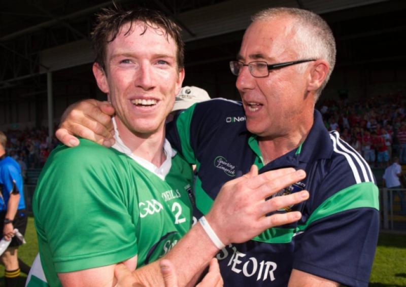 Limerick manager John Allen and half-forward Seamus Hickey embrace following the county's stunning Munster final victory over Cork