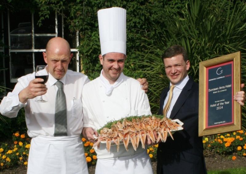 Denis O'Riordan, David Hayes and Hugh Murphy show their delight in the Dunraven Arms Hotel winning the award for the best hotel in Ireland