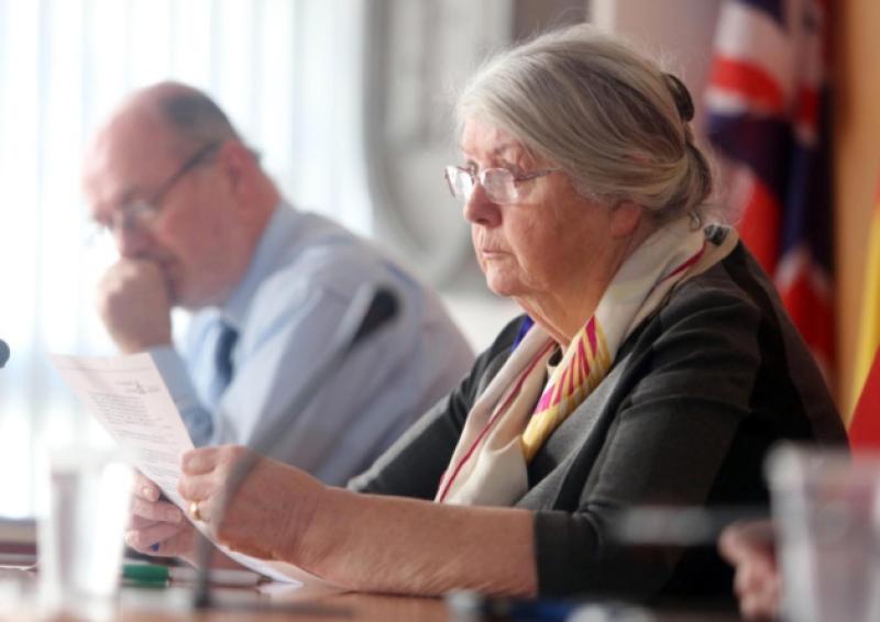 At Friday's meeting, Mayor Kathleen Leddin inspects the legal letter. City official Eugene Griffin watches on. Picture: Brian Arthur/ Press 22.