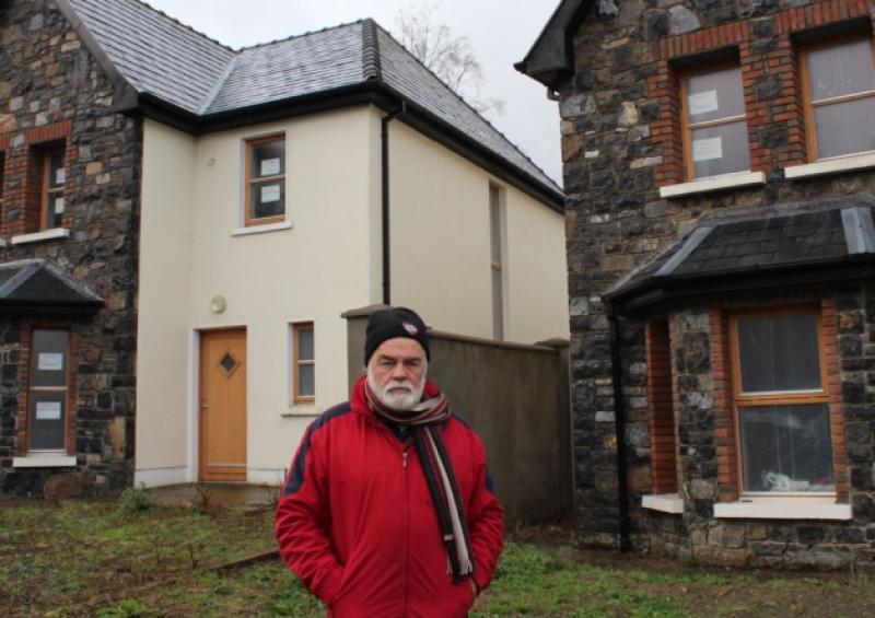 John Ryan, from Caherconlish, outside the house he owns in Ard na Deirge, Killaloe. He broke into it in July, has been working on it ever since and hopes to move in in February [Picture: Michael Cowhey]