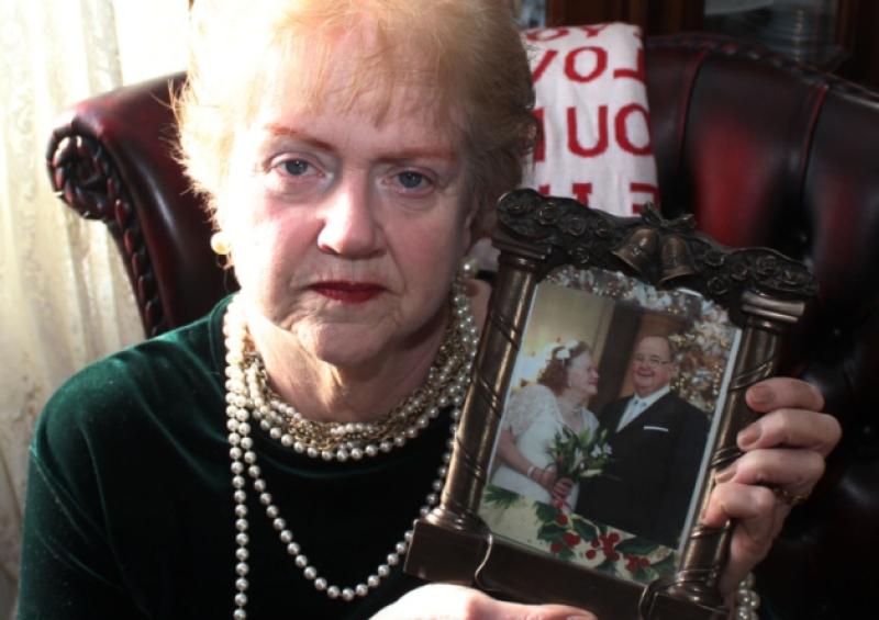 Bridie Kelly O'Shaughnessy holding a photo of her and her husband Paddy O'Shaughnessy, at her home in Adare and, below, a photo of the couple on their wedding day at San Francisco City Hall. Picture: Michael Cowhey