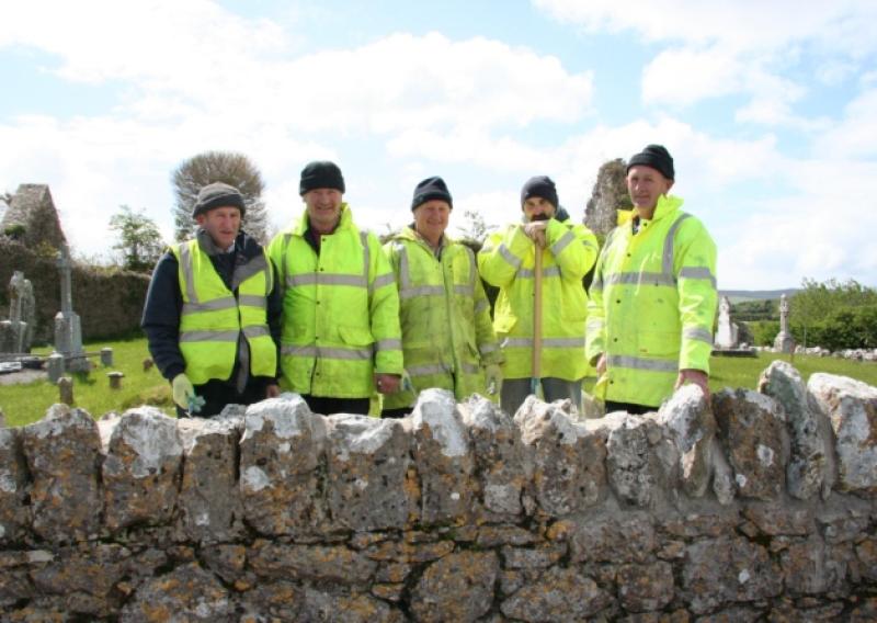 Tom Lenihan, Michael Barry, John Collum, George Simpson and Seamus Lenihan taking part in the lime mortar training course at Mungret cemetery