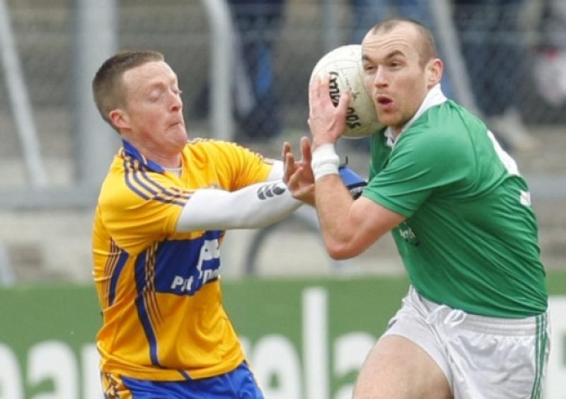 Steven Lavin of Limerick is challenged by Chris Dunning of Clare in Cusack Park