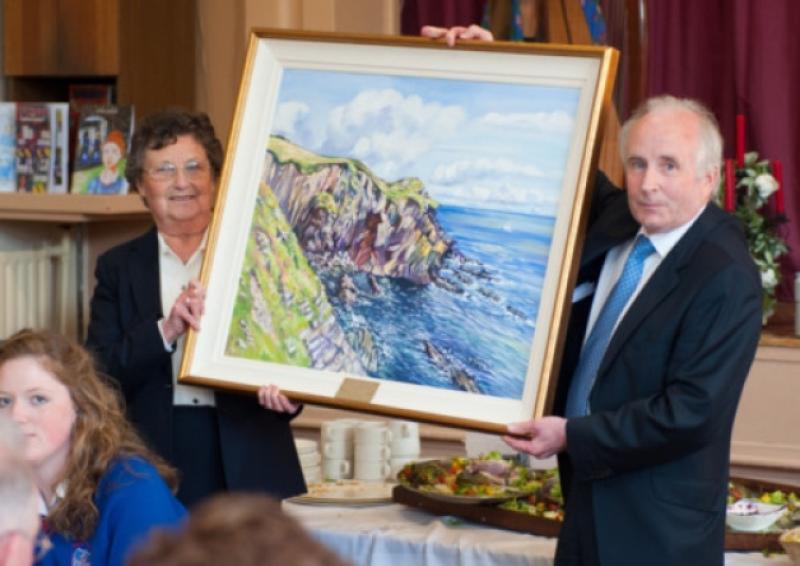Sr Mary McMahon, on behalf of the Sisters of Mercy, receives a painting from St Joseph's board of management chair, Dr John O'Brien. Picture: Kyran Ryan