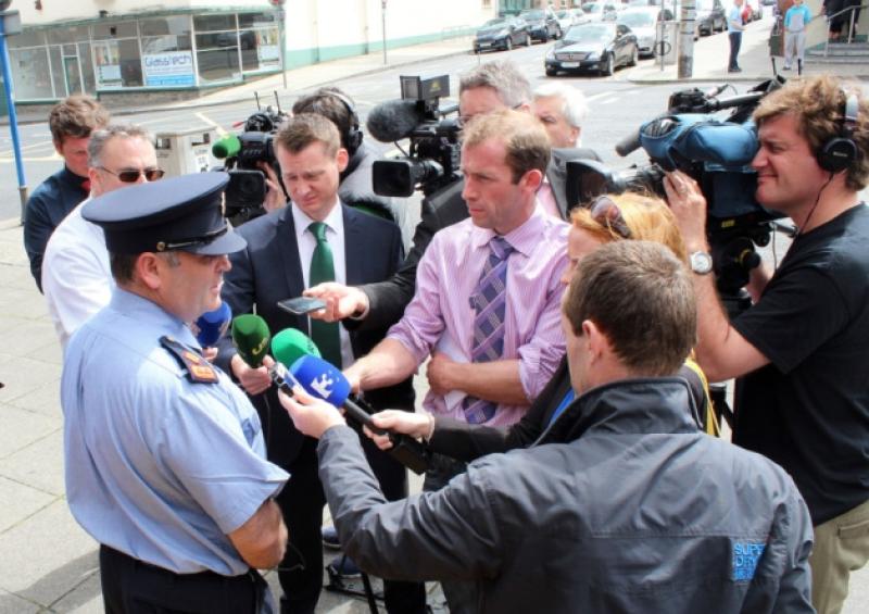 Superintendent Derek Smart at the press briefing outside Henry Street garda station this Monday and below, the scene of the shooting in UL. Pictures: Mike Cowhey