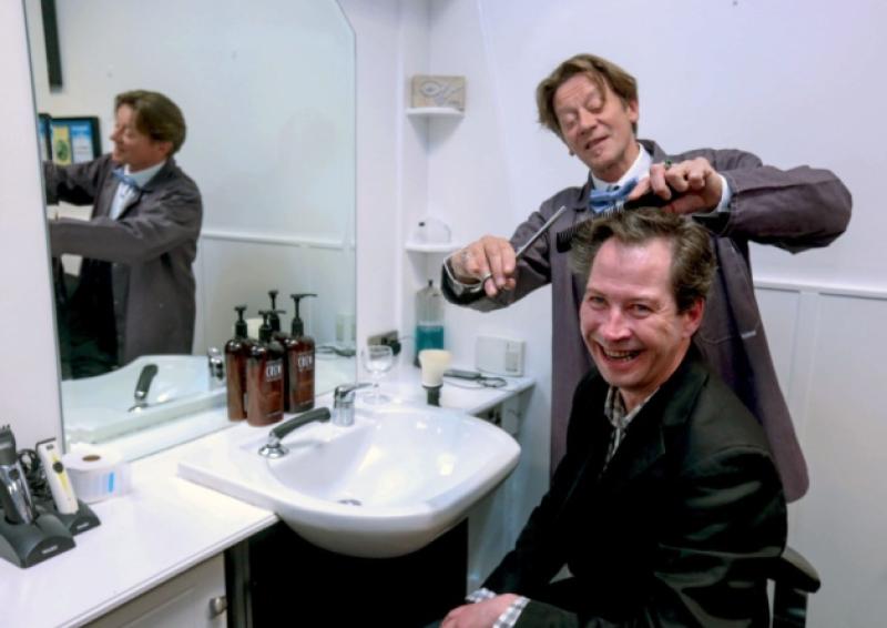 Myles Breen gets a trim from leading actor Brendan Conroy at the launch of the The Bachelor of Kilkish, which opens this Wednesday. Picture: Keith Wiseman