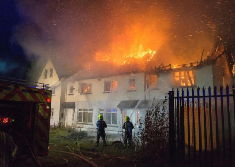 The dramatic scene as firefighters battle the blaze in Cois Sruthain housing estate in Croom last week. Picture: Colm Kiely