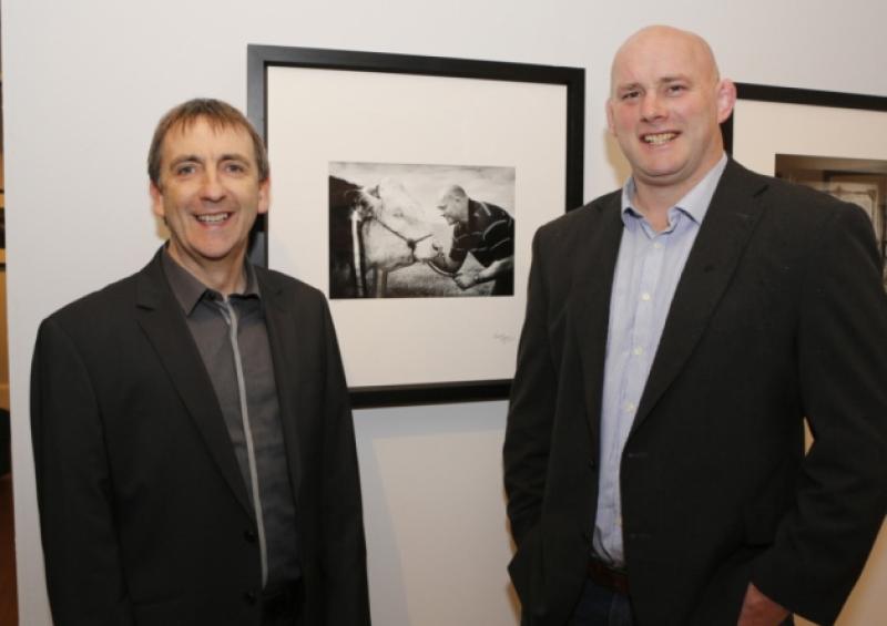 Top lensman: Cormac Byrne poses for a photograph at the launch of his exhibition at the Hunt Museum with John Hayes. Picture: Liam Burke/Press 22