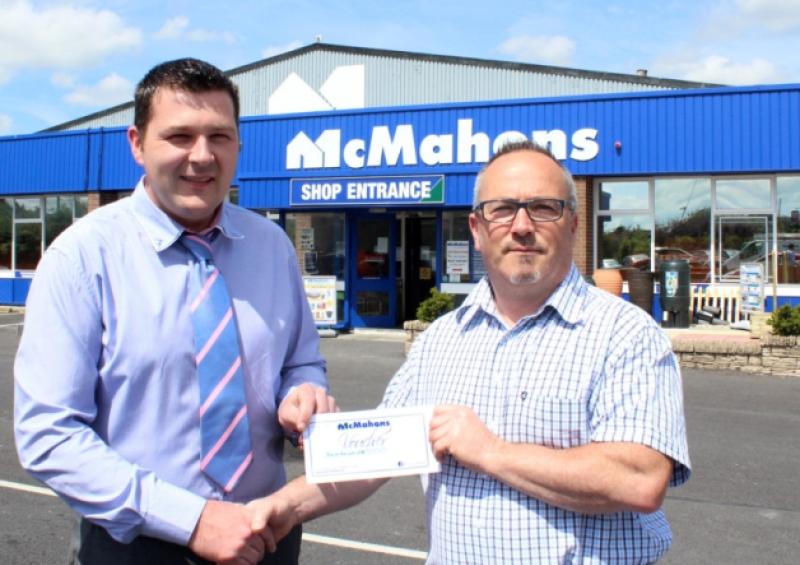 Manager Shane O'Dwyer presents 'chuffed' Roy Horgan with �500