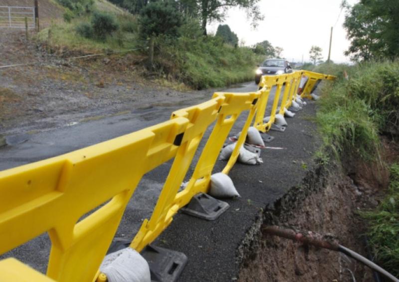 One of the Bridges in Lacka , Doon, after the effects of the Flash Floods and (below) locals halp with the cleanup [Pictures: Brendan Gleeson]