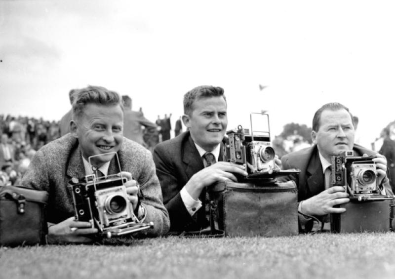 An expert in his field: Donal MacMonagle right, who founded the Leader's photographic department in the early 1950s, with his brothers Harry and Louie. Below, Owen South and Dermot Lynch with then Bishop Dr Jeremiah Newman in 1989
