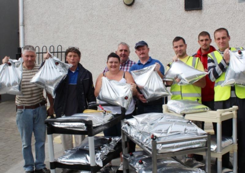Volunteers ready to distribute water at St Munchin's Community Centre; this continued through the weekend