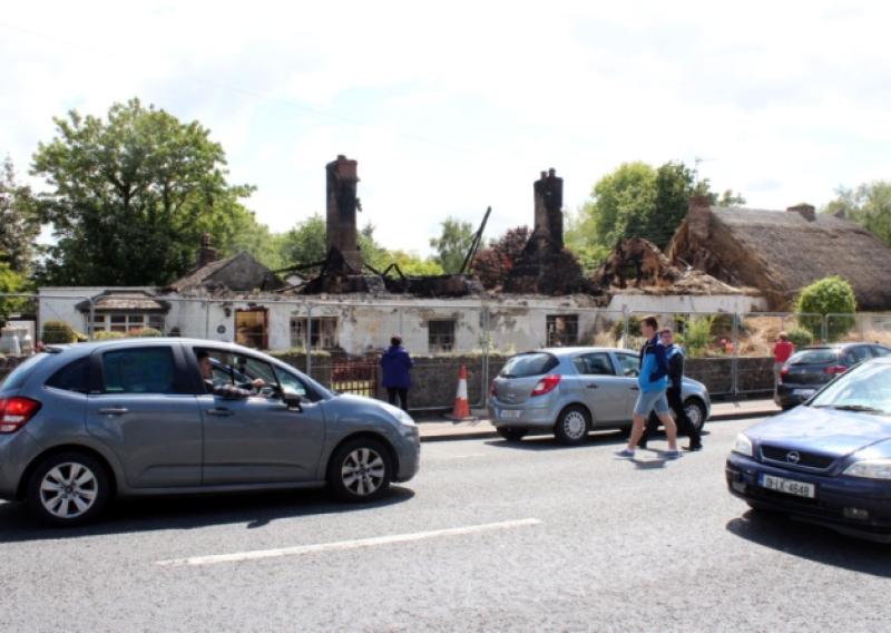 Traumatic incident: the two 'iconic' cottages on Main Street in Adare, which were destroyed by Saturday's fire in the Limerick village, which was battled by up to seven units of the fire service. Picture: Mike Cowhey