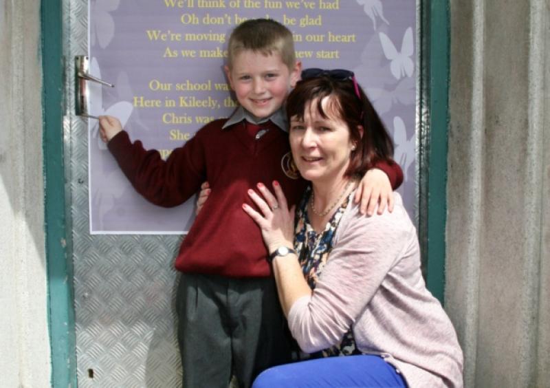 Aaron Price from Thomondgate shutting the school doorat St Lelia's NS for the last time with the principal, Chris Deely [Picture: Adrian Butler]