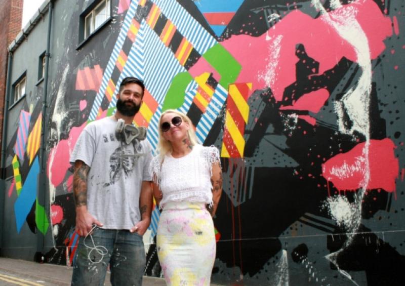 Draw Out's Catherine O'Halloran with Elliot O'Donnell - or Askew One - on Little William Street in front of a massive mural that the New Zealander worked on with enigmatic Irish artist Maser. Some seven such murals appeared around the city this week, like Fintan McGee's one below. More will take shape in August.Pictures: Adrian Butler