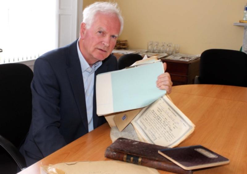 Gerry Boland goes through the GAA records which he discovered at his father-in-law's home in Ballinacurra [Picture: Adrian Butler]