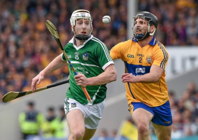 Cian Lynch, Limerick, in action against Domhnall O'Donovan, Clare during the Munster SHC