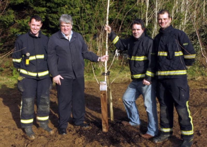 Tony Dowling, Greg Conway, Joe Donegan and Shane McCann with a tree dedicated to Kilmallock Fire and Rescue Service