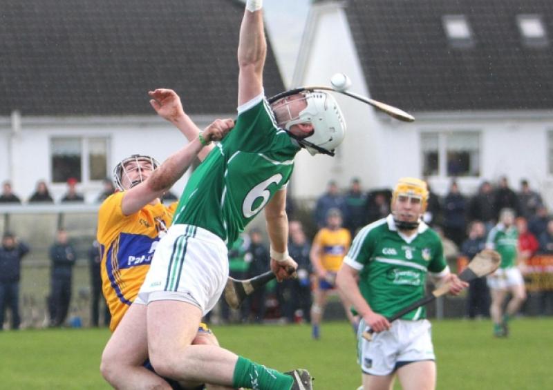 Pull hard: The hurley of Clare's Nicky O'Connell getting up close and personal with Limerick's Cathal McNamara - and apparently defying the laws of physics in the process - during the Waterford Crystal Cup clash in Sixmilebridge. The picture was taken by Tony Grehan, below