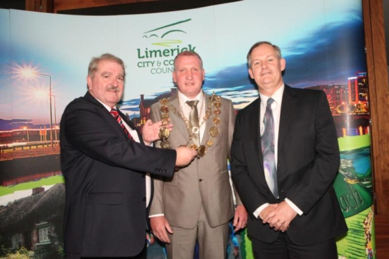 Cllr Liam Galvin is congratulated by City and County Council CEO Conn Murray and outgoing Mayor Kevin Sheahan on his election as Limerick's first citizen.  Picture: Dave Gaynor