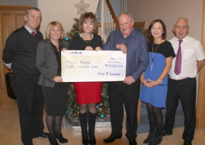 Dinny McSweeney is pictured presenting the cheque to Joan Freeman, founder of Pieta House with Kieran OBrien, Annette Cahill, Johnny Togher and Nora Conway of Pieta House.
