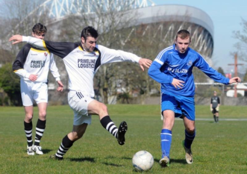 Darren Harrington, of Aisling Annacotty, in action against Eddie Radcliffe, Ballynanty Rovers, in their Premier Division clash at Shelbourne Park