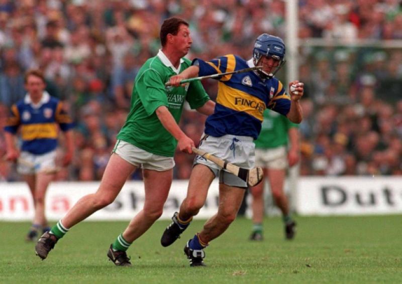Tipperary's Colm Bonnar holds off the challenge of Limerick's Frankie Carroll in 1996