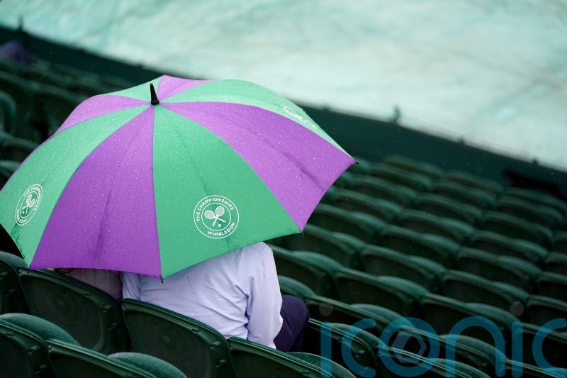 Rain makes early appearance as Wimbledon gets under way