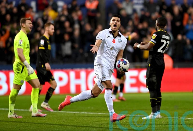 Joel Piroe’s late penalty earns Swansea a point after fightback against Wigan