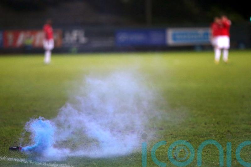 Melbourne derby abandoned as goalkeeper hit by metal bucket in ‘shocking scenes’