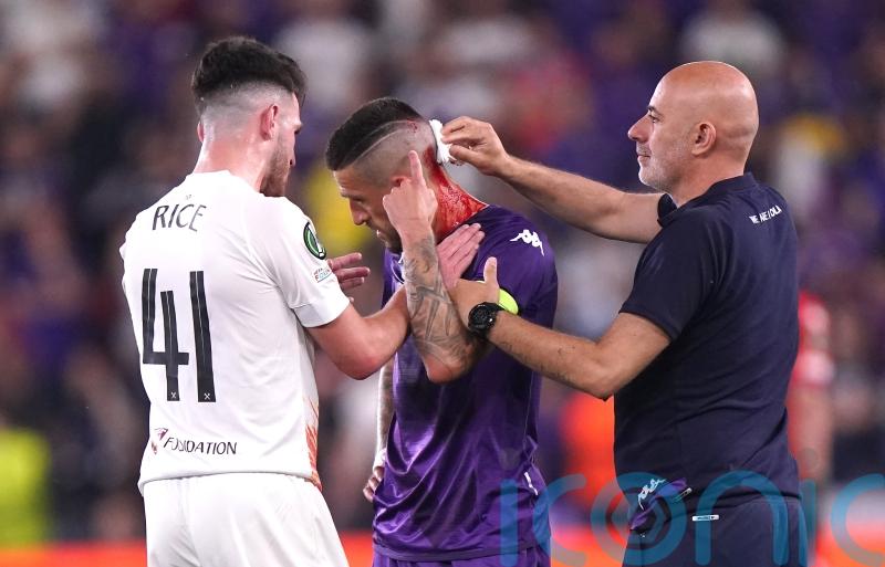 Fiorentina’s Cristiano Biraghi struck by object thrown from West Ham fans