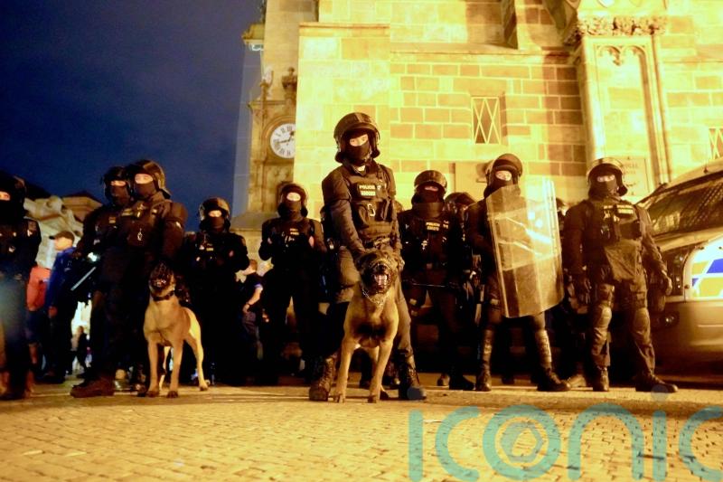 West Ham fans clash with riot police during European final celebrations