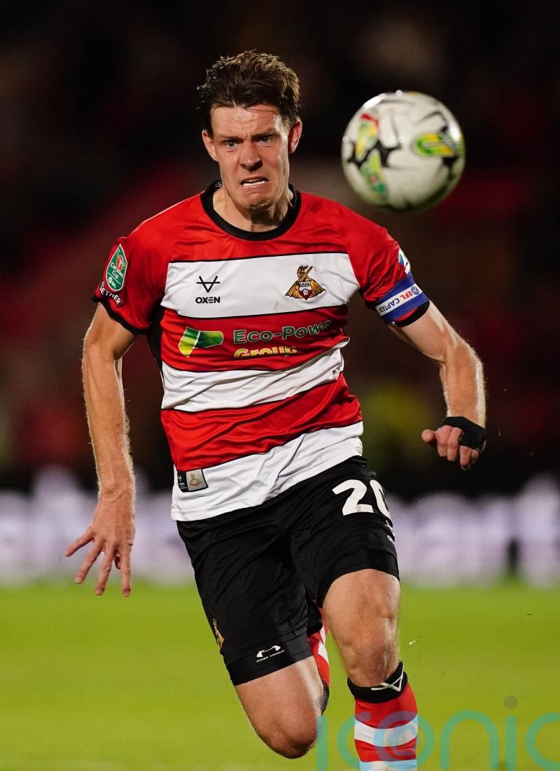 Ten-man Doncaster secure League Two play-off spot with draw at Gillingham