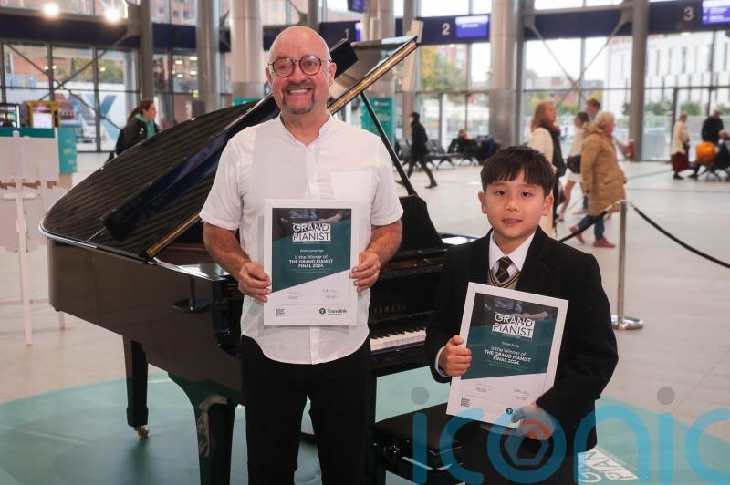 Boy, 10, and aid worker triumph in piano contest at Grand Central Station