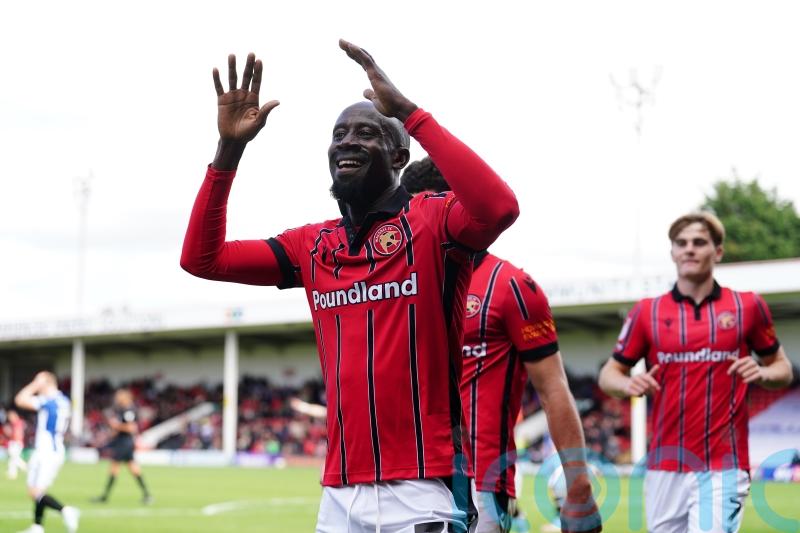 Walsall win at windy Harrogate to extend lead at top of League Two
